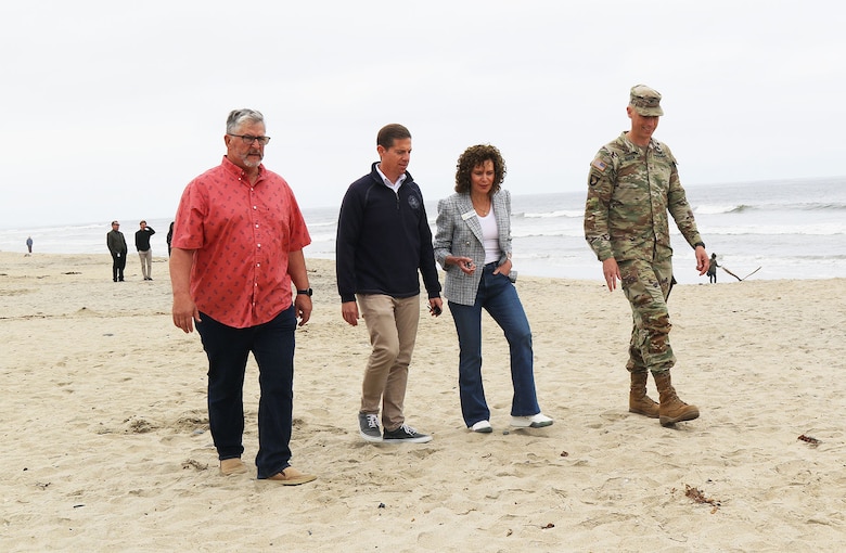 From left to right, Encinitas Mayor Tony Kranz, Rep. Mike Levin with California’s 49th District, Solana Beach Mayor Lesa Heebner and Col. Andrew Baker, U.S. Army Corps of Engineers Los Angeles District commander, walk along Moonlight State Beach following a May 13 press conference celebrating the completion of sand placement on the beach in Encinitas, California.
