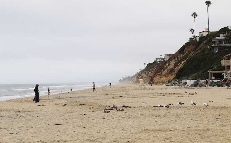 Community members enjoy the newly placed sand May 13 at Moonlight State Beach in Encinitas, California.