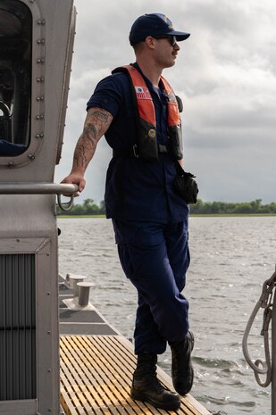 Man Standing on Boat