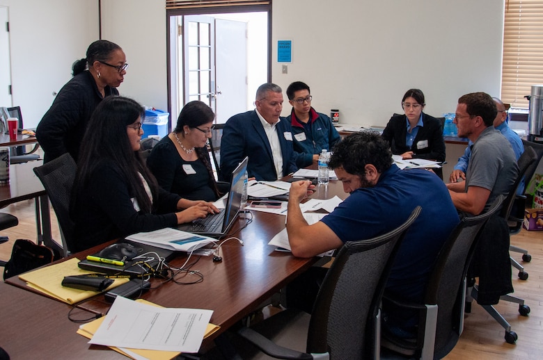 Representatives from multiple local, state and federal agencies participate in a Whittier Narrows Dam Tabletop Exercise at the U.S. Army Corps of Engineers Baseyard May 23 in South El Monte, Calif. After the exercise concluded, participants shared their feedback on areas of successes and improvements. During the exercise, participants broke into teams and worked together to determine how to communicate between agencies and to the public during a flood emergency.