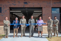 Members of the 628th Logistics Readiness Squadron prepare to cut the ribbon.