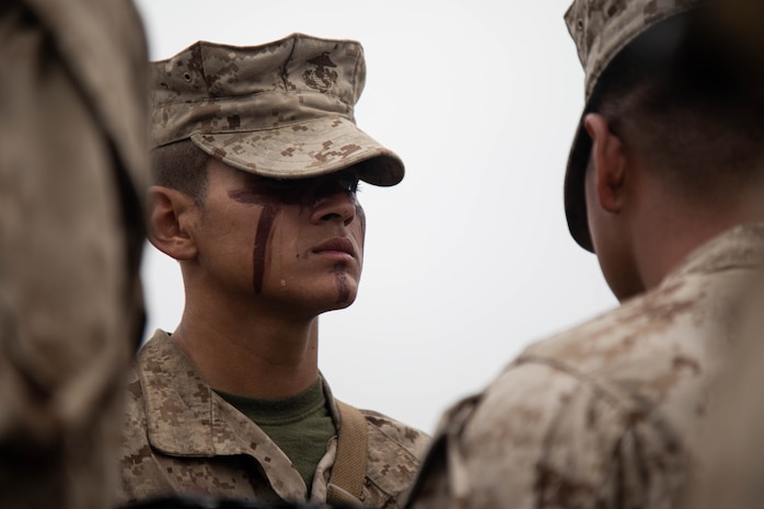 U.S. Marine Corps Pvt. Jonathan Castro-Diaz, a Marine with Bravo Company, 1st Recruit Training Battalion, Recruit Training Regiment, stands in formation during an Eagle, Globe and Anchor ceremony on Marine Corps Base Camp Pendleton, California, June 5, 2024. The EGA ceremony was the final event of the Crucible and represents the transformation of recruit to Marine. (U.S. Marine Corps photo by Cpl. Elliott A. Flood-Johnson)