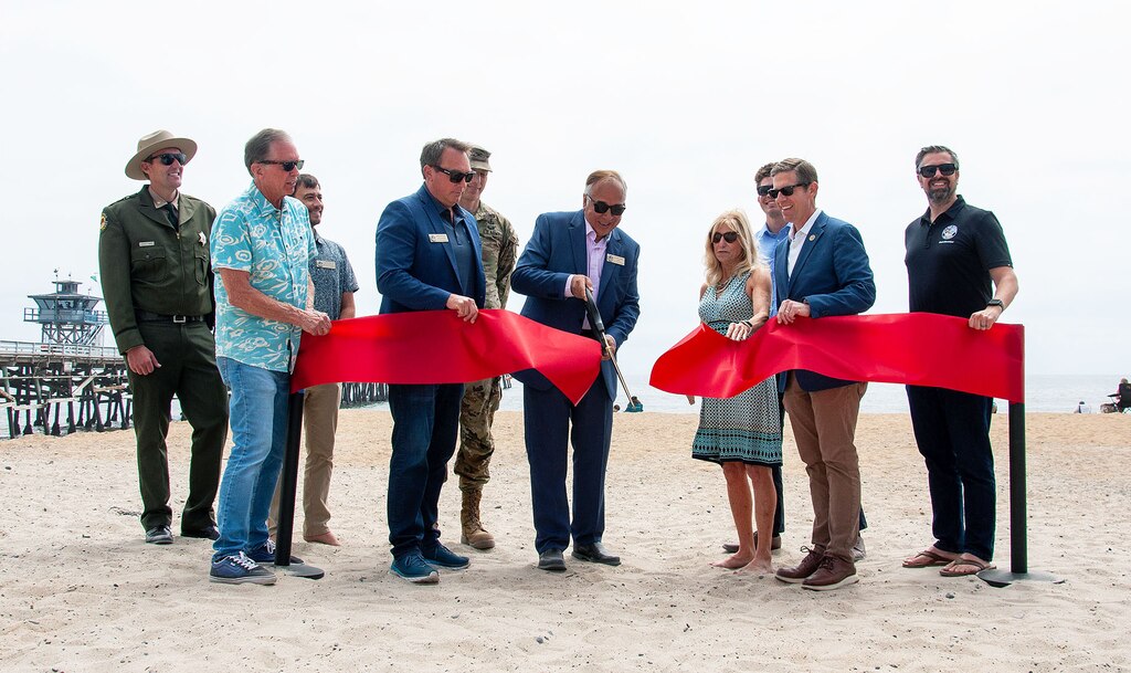 Representatives from various city, state and federal agencies participate in a ribbon-cutting ceremony to celebrate the completion of Phase One of the San Clemente Beach Nourishment project May 31 in San Clemente, Calif. The project includes the construction of a 50-foot-wide beach fill along a 3,412-foot-long stretch of shoreline, using 251,000 cubic yards of compatible sediment.