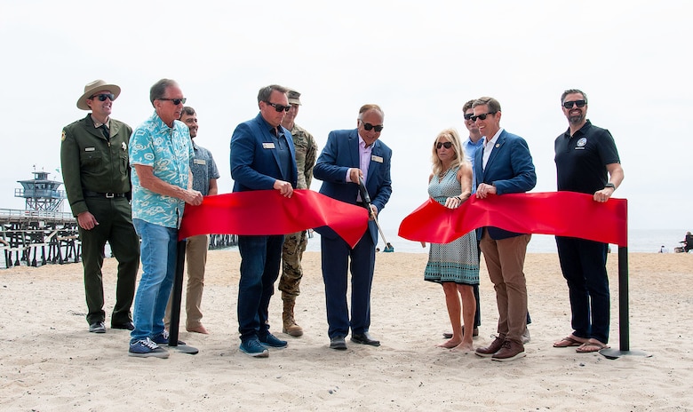 Representatives from various city, state and federal agencies participate in a ribbon-cutting ceremony to celebrate the completion of Phase One of the San Clemente Beach Nourishment project May 31 in San Clemente, Calif. The project includes the construction of a 50-foot-wide beach fill along a 3,412-foot-long stretch of shoreline, using 251,000 cubic yards of compatible sediment.