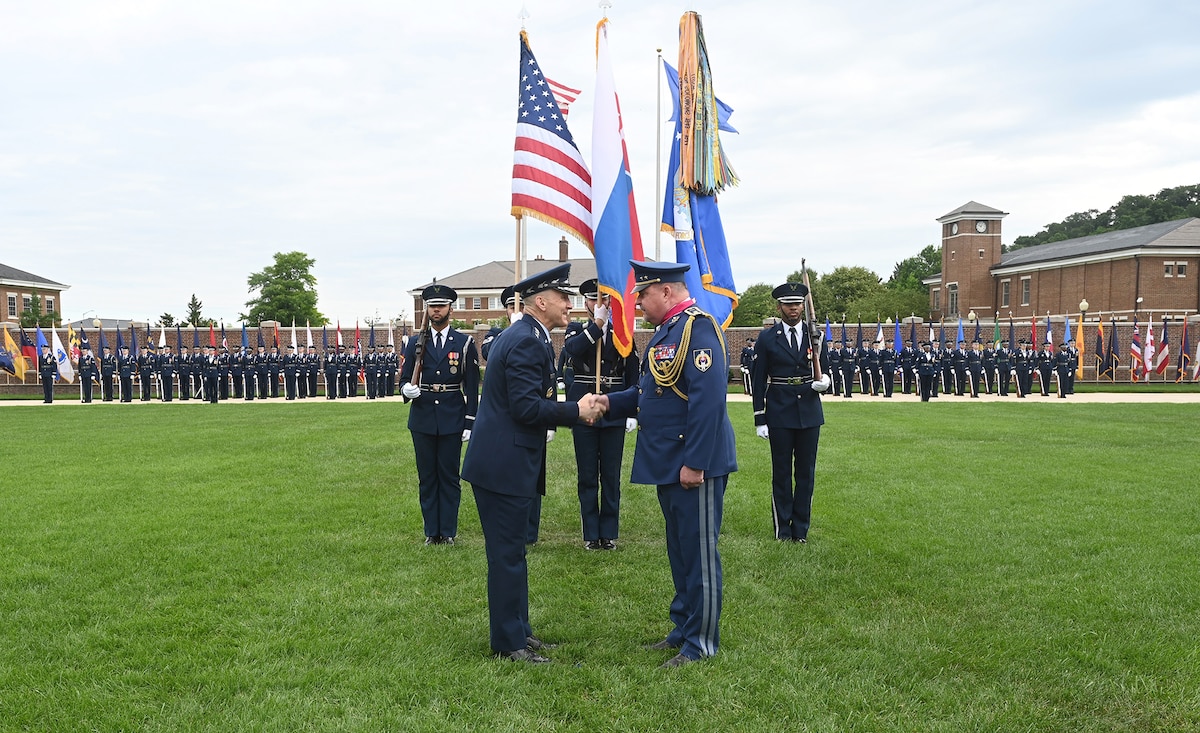 Air Force Chief of Staff Gen. David Allvin presents a medal to Slovak Air Force Commander Maj. Gen. Róbert Tóth during an official welcome ceremony at Joint Base Anacostia-Bolling, Washington, D.C. June 11, 2024. The ceremony was part of a week-long counterpart visit during which Tóth was taken to different Air Force installations around the country in an effort to advance mutual interests and strengthen the U.S.-Slovak partnership. (U.S. Air Force photo by Andy Morataya)