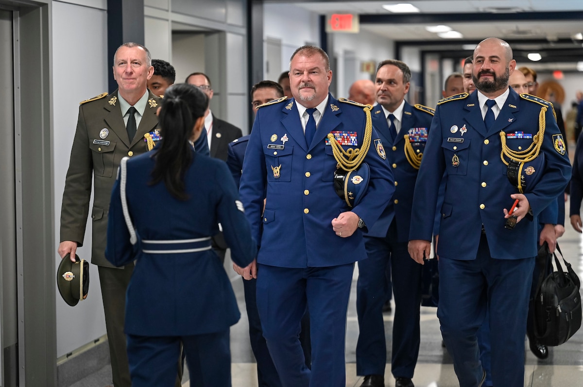 U.S. Air Force Honor Guard Senior Airman Alyssa Zamora leads a Pentagon tour for Slovak Air Force Commander Maj. Gen. Róbert Tóth, center, along with Slovak and American staff in Arlington, Va., June 11, 2024. (U.S. Air Force photo by Eric Dietrich)