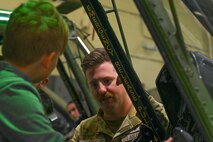 U.S. Air Force Staff Sgt. Jesse Laker, 54th Helicopter Squadron evaluator flight engineer, answers questions during a UH-1N Iroquois helicopter static display tour at Minot Air Force Base, North Dakota, June 10, 2024. The tour was held in support of the STARBASE Program, which supplied students with 25 hours of enriching experiences at more than 80 Air Force, Air Force Reserve, Army, National Guard, Navy, and Space Force bases across the United States, Guam, and Puerto Rico.