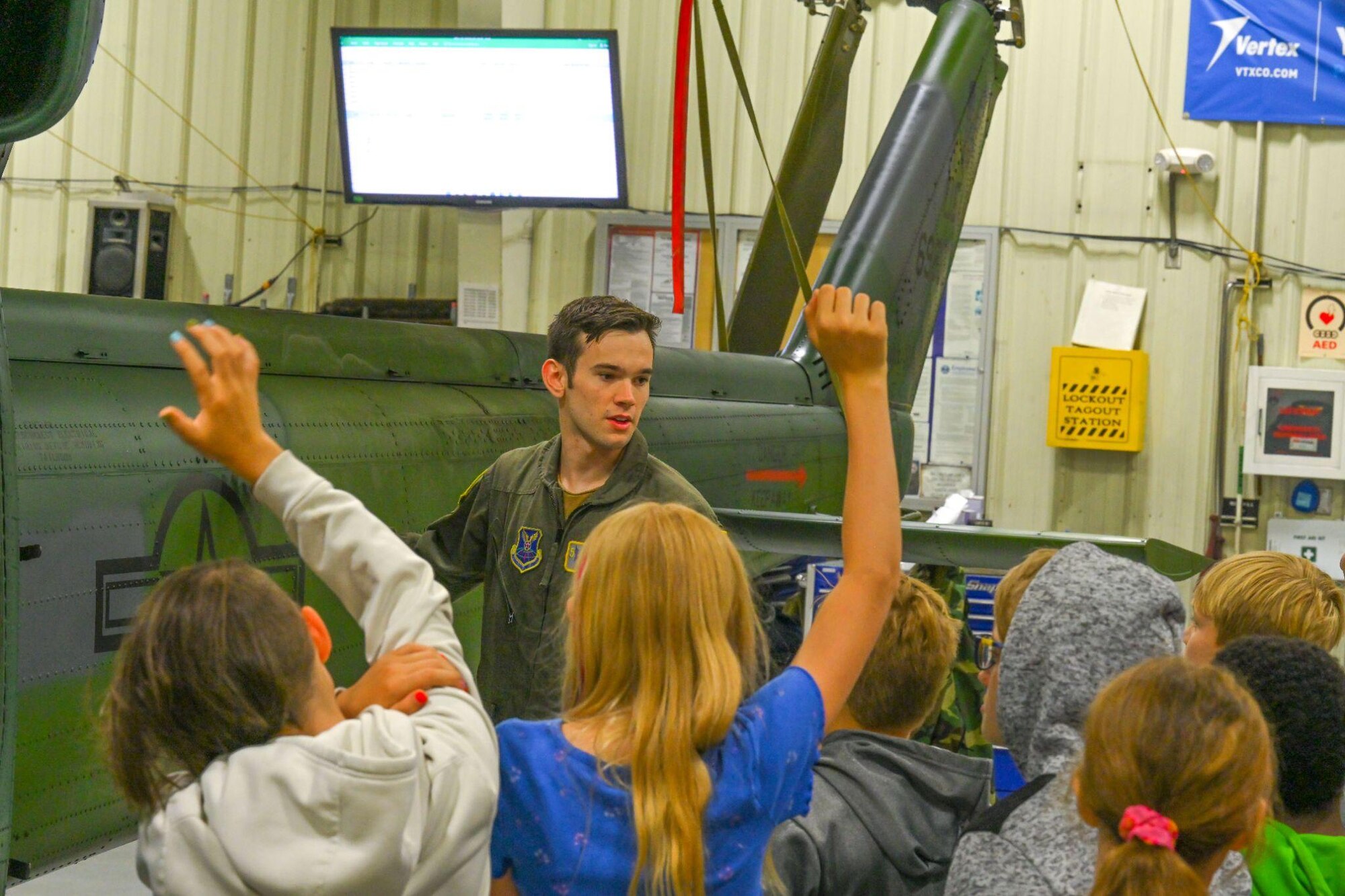 U.S. Air Force Airman 1st Class Jacob Young, 54th Helicopter Squadron special mission aviator and Department of Defense sponsored- STARBASE Science, Technology, Engineering, & Math (STEM) tour leader, answers questions during a UH-1N Iroquois helicopter display tour at Minot Air Force Base, North Dakota, June 10, 2024. The students took part in hands-on activities in STEM with a military focus to explore careers and observe real-world applications.