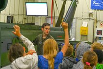 U.S. Air Force Airman 1st Class Jacob Young, 54th Helicopter Squadron special mission aviator and Department of Defense sponsored- STARBASE Science, Technology, Engineering, & Math (STEM) tour leader, answers questions during a UH-1N Iroquois helicopter display tour at Minot Air Force Base, North Dakota, June 10, 2024. The students took part in hands-on activities in STEM with a military focus to explore careers and observe real-world applications.