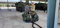 Staff Sgt. Daniel Corser, 1st Battalion, 205th Regimental Training Institute, Washington National Guard, observes members of the 112th Stryker Regiment, Royal Thai Army, while they conduct recovery operations during a Stryker subject matter exchange in Chon Buri, Thailand, May 6-17, 2024.