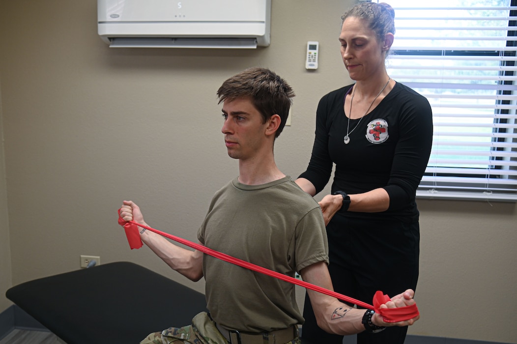 U.S. Air Force Maj. Andrea Shefferly, Operational Support Teams flight commander, examines Senior Airman Zach Heimbuch, 17th Training Wing public affairs specialist, at Goodfellow Air Force Base, Texas, May 30, 2024. OST provides proactive care, whether it’s an acute injury, a chronic condition, or a need for lifestyle guidance.  (U.S. Air Force photo by Airman 1st Class James Salellas)