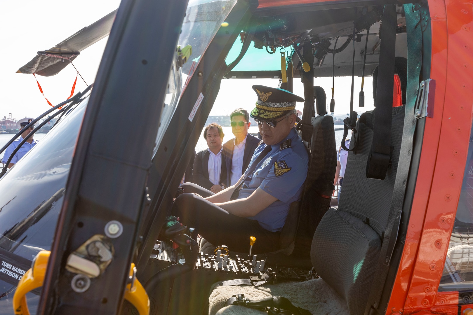 Commissioner General. Kim Jong-Uk, Korea Coast Guard, sits inside a U.S. Coast Guard MH-65E helicopter during a ship tour of the U.S. Coast Guard Cutter Waesche (WMSL-751) in Pohang, Republic of Korea, June 9, 2024. U.S. Coast Guardsmen welcomed the mayor of Pohang and leaders from the Korea Coast Guard aboard for a tour to highlight capabilities and best practices used by the U.S. Coast Guard. Waesche is assigned to Destroyer Squadron (DESRON) 15, the Navy’s largest DESRON and the U.S. 7th Fleet’s principal surface force. The U.S. Coast Guard has operated in the Indo-Pacific for more than 150 years, and the service is increasing efforts through targeted patrols with our National Security Cutters, Fast Response Cutters and other activities in support of Coast Guard missions to enhance our partnership. (U.S. Marine Corps photo by Cpl. Elijah Murphy)