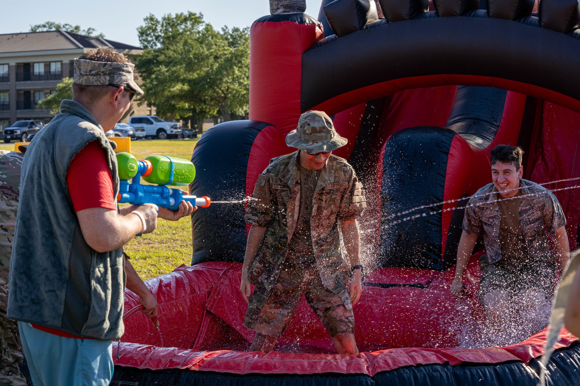 A U.S. Airman encounters a line of aquatic attacks at the end of his journey through the obstacle course during the 2024 81st Mission Support Group Resiliency Dining-Out on Keesler Air Force Base, Mississippi, June 7, 2024.