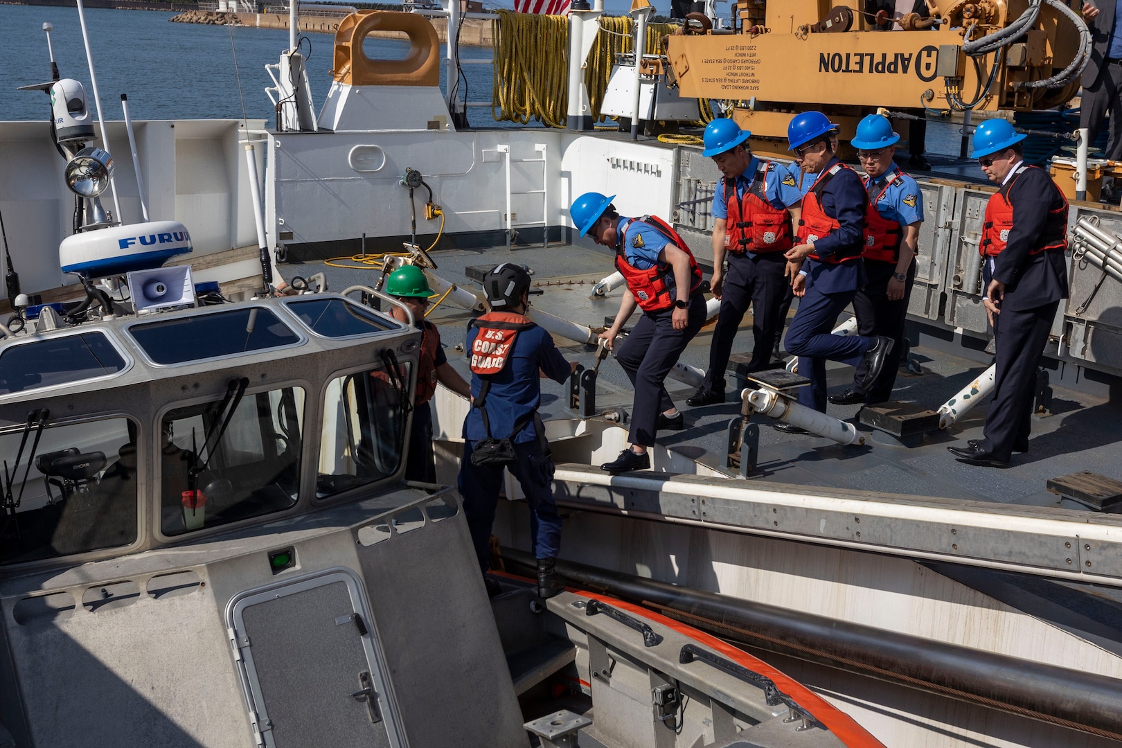 U.S. Coast Guardsmen assigned to the U.S. Coast Guard Cutter Waesche (WMSL-751) help leaders from the Korea Coast Guard, as well as Lee Kang-Deok, the mayor of Pohang, Republic of Korea, and Consul General Nolan Barkhouse, the U.S. Consul General to the Republic of Korea, board a small boat during a tour of the Waesche in Pohang, Republic of Korea, June 9, 2024. U.S. Coast Guardsmen welcomed the mayor of Pohang and leaders from the Korea Coast Guard aboard for a tour to highlight capabilities and best practices used by the U.S. Coast Guard. Waesche is assigned to Destroyer Squadron (DESRON) 15, the Navy’s largest DESRON and the U.S. 7th Fleet’s principal surface force. Waesche is deployed to the Indo-Pacific to advance relationships with ally and partner nations to build a more stable, free, open and resilient region with unrestricted, lawful access to the Maritime Commons. (U.S. Marine Corps photo by Cpl. Elijah Murphy)