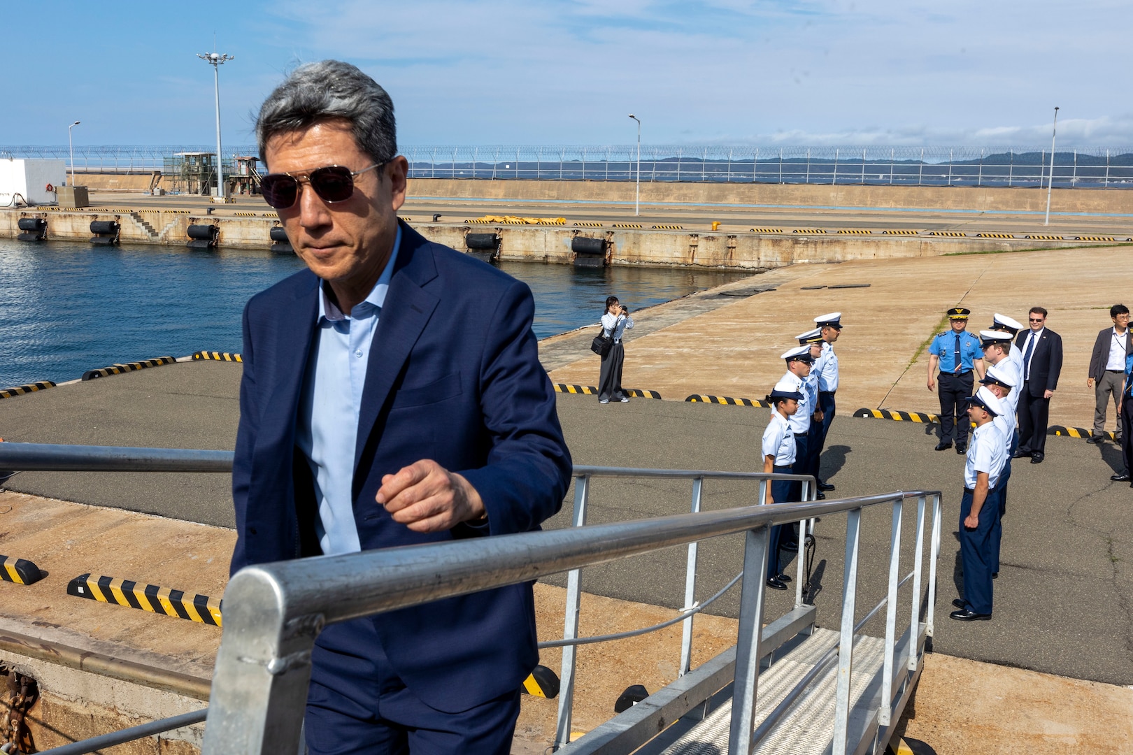 Mayor Lee Kang-Deok, the mayor of Pohang, Republic of Korea, boards the U.S. Coast Guard Cutter Waesche (WMSL-751), during a ship tour in Pohang, Republic of Korea, June 9, 2024. U.S. Coast Guardsmen welcomed the mayor of Pohang and leaders from the Korea Coast Guard aboard for a tour to highlight capabilities and best practices used by the U.S. Coast Guard. Waesche is deployed to the Indo-Pacific to advance relationships with ally and partner nations to build a more stable, free, open and resilient region with unrestricted, lawful access to the Maritime Commons. (U.S. Marine Corps photo by Cpl. Elijah Murphy)