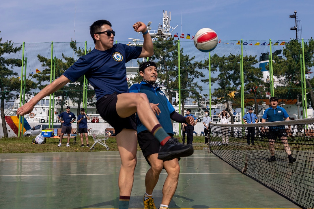 U.S. Coast Guardsmen Seaman Larry Zhou, assigned to the U.S. Coast Guard Cutter Waesche (WMSL-751), kicks a ball during a sports day in Pohang, Republic of Korea, June 10, 2024. United States and Korea Coast Guardsmen came together to play jokgu to build stronger relationship and cooperation between the servicemembers of each nation. Waesche is the second U.S. Coast Guard National Security Cutter deployed to the Indo-Pacific in 2024. Coast Guard cutters routinely deploy to the region to engage with partner nations to ensure a free and open Indo-Pacific. (U.S. Marine Corps photo by Cpl. Elijah Murphy)