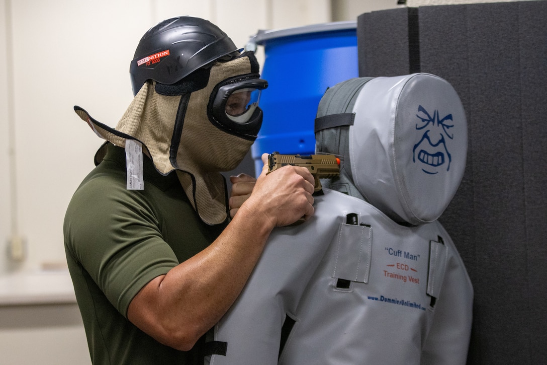 United States Marine Corps police with the Provost Marshal's Office engaged in active shooter training at Marine Corps Logistics Base Barstow, California, June 11, with support from MCLB Barstow's Military Working Dog Section. 



The intent of the training is to build PMO connections and skills within the law enforcement community through roleplay and response procedures. The PMO skills and knowledge were tested against role players who responded organically to the dynamic exercises. (U.S. Marine Corps photo by Public Affairs Specialist Vanessa Schell)