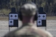 An Army National Guardsmen from 1st Battalion, 297th Infantry Regiment surveys his pistol targets while competing in The Adjutant General’s Match at Joint Base Elmendorf-Richardson, Alaska, May 20, 2024.