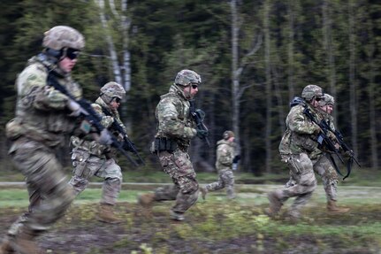 Alaska Air and Army National Guardsmen conduct a movement to fire during the rifle portion of The Adjutant General’s Match at Joint Base Elmendorf-Richardson, Alaska, May 22, 2024.