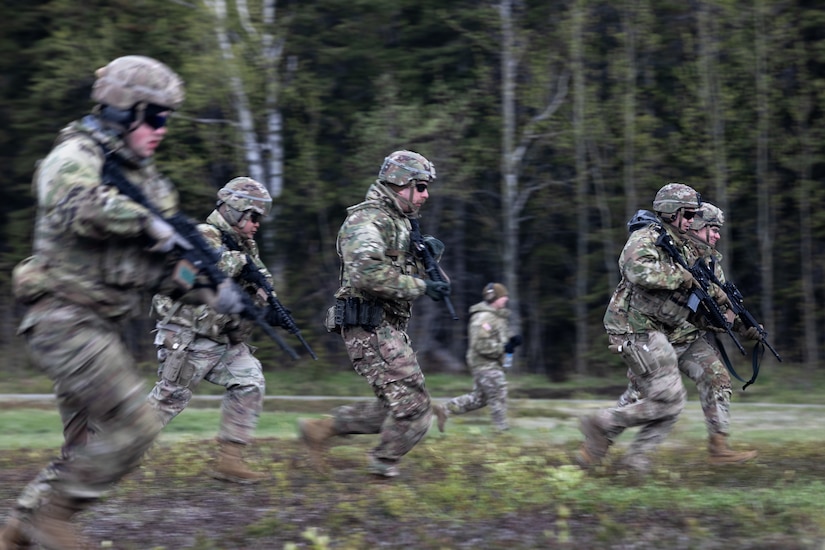 Alaska Air and Army National Guardsmen conduct a movement to fire during the rifle portion of The Adjutant General’s Match at Joint Base Elmendorf-Richardson, Alaska, May 22, 2024.