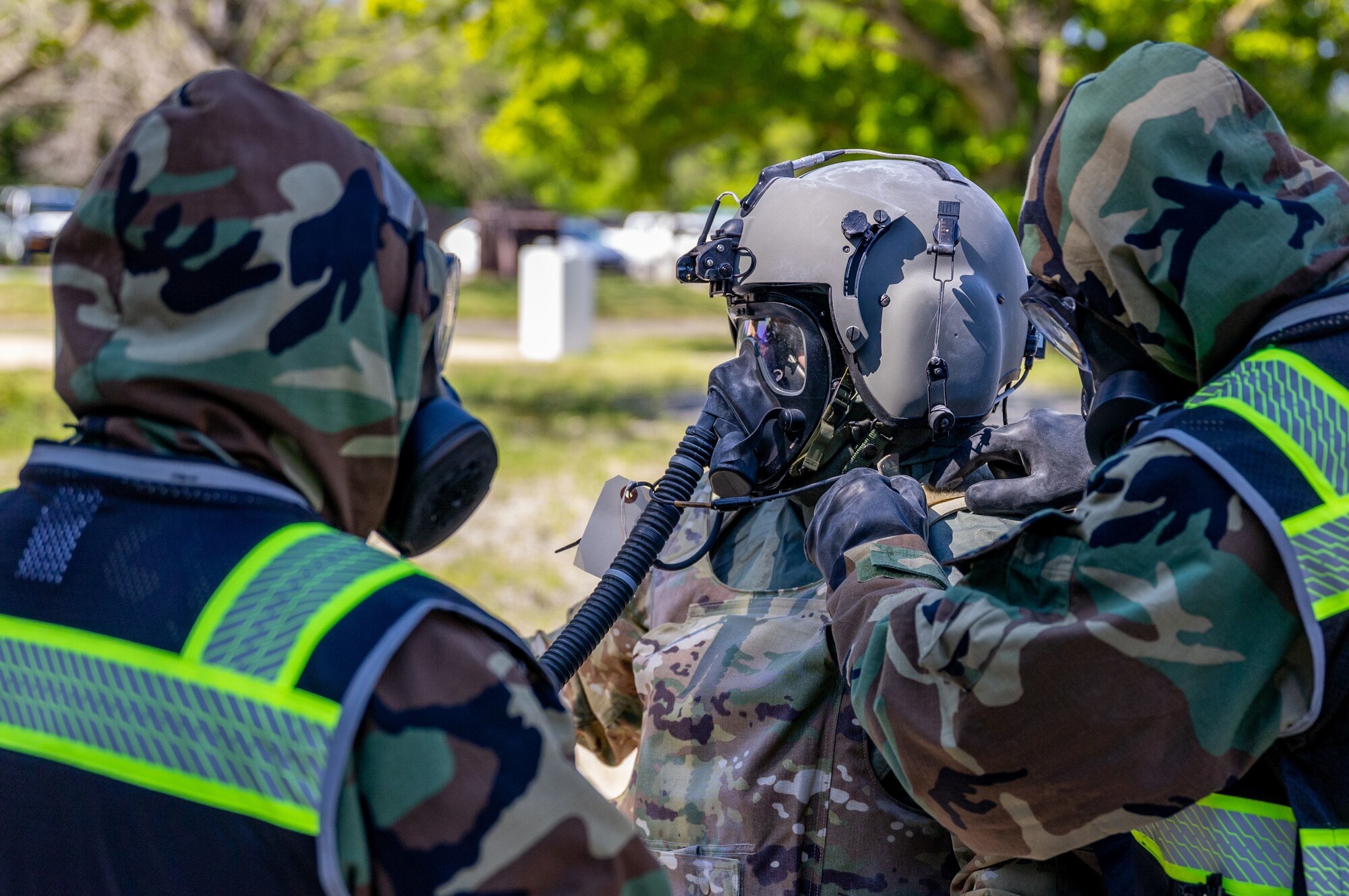 Aircrew Flight Equipment trainees participate in a chemical decontamination exercise during Toxic Arch at Scott AFB, Ill. June 13, 2024. Toxic exercises are held annually by different commands within the Air Force, they allow AFE Airmen to train for real-world decontamination scenarios. (U.S. Air Force Photo by Chris Bishop)