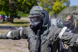 Aircrew Flight Equipment trainees participate in a chemical decontamination exercise during Toxic Arch at Scott AFB, Ill. June 13, 2024. Toxic exercises are held annually by different commands within the Air Force, they allow AFE Airmen to train for real-world decontamination scenarios. (U.S. Air Force Photo by Chris Bishop)