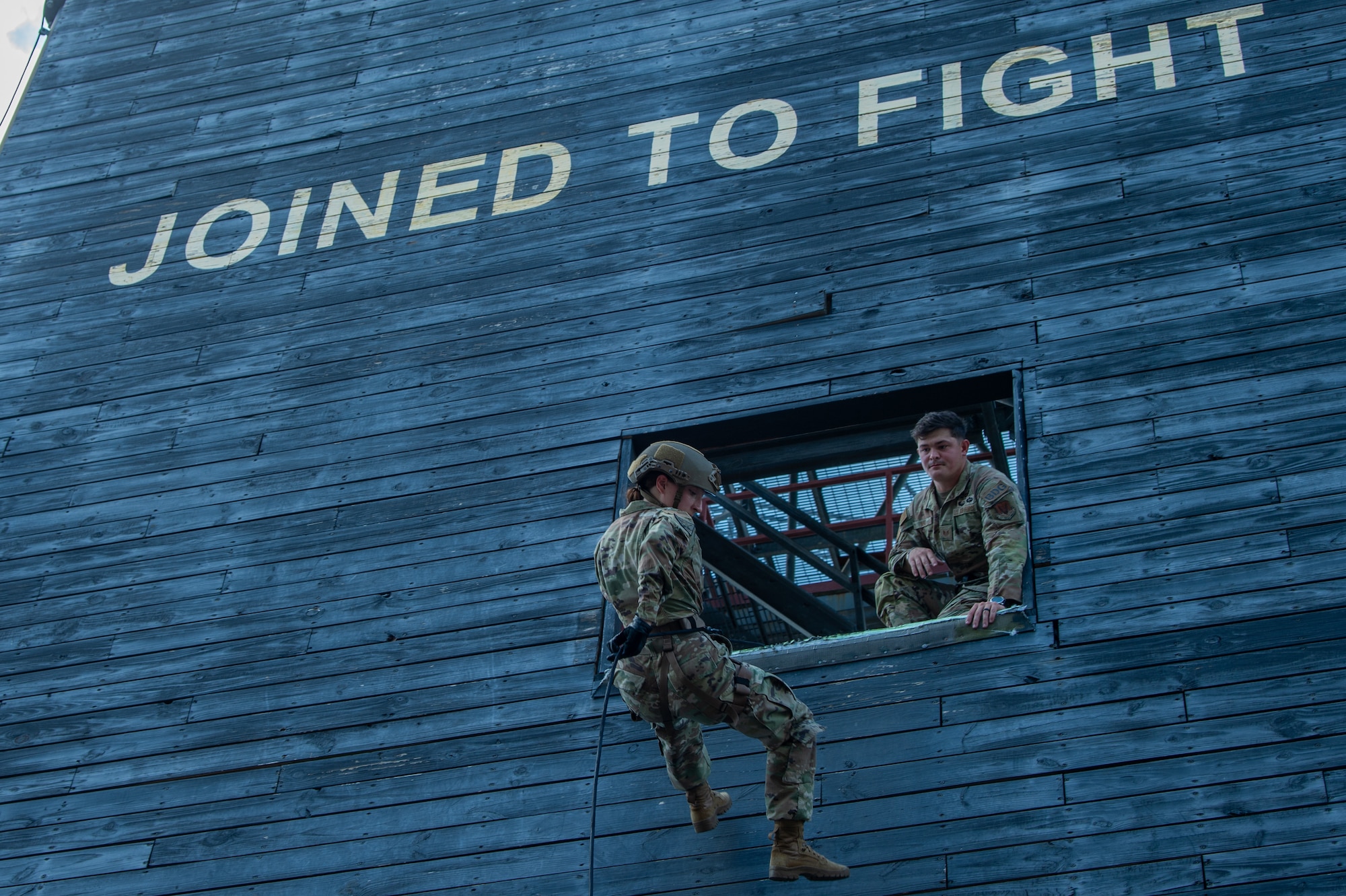 U.S. Air Force Cadet 2nd Class Mary Allen, U.S. Air Force Academy cadet, Squad 24, rappels down a tower at Moody Air Force Base, Georgia, June 7, 2024. The cadets spent the day learning how to rappel down a wall and did a mock mission with the 820th Base Defense Group to better understand base defense operations. (U.S. Air Force photo by Airman 1st Class Iain Stanley)