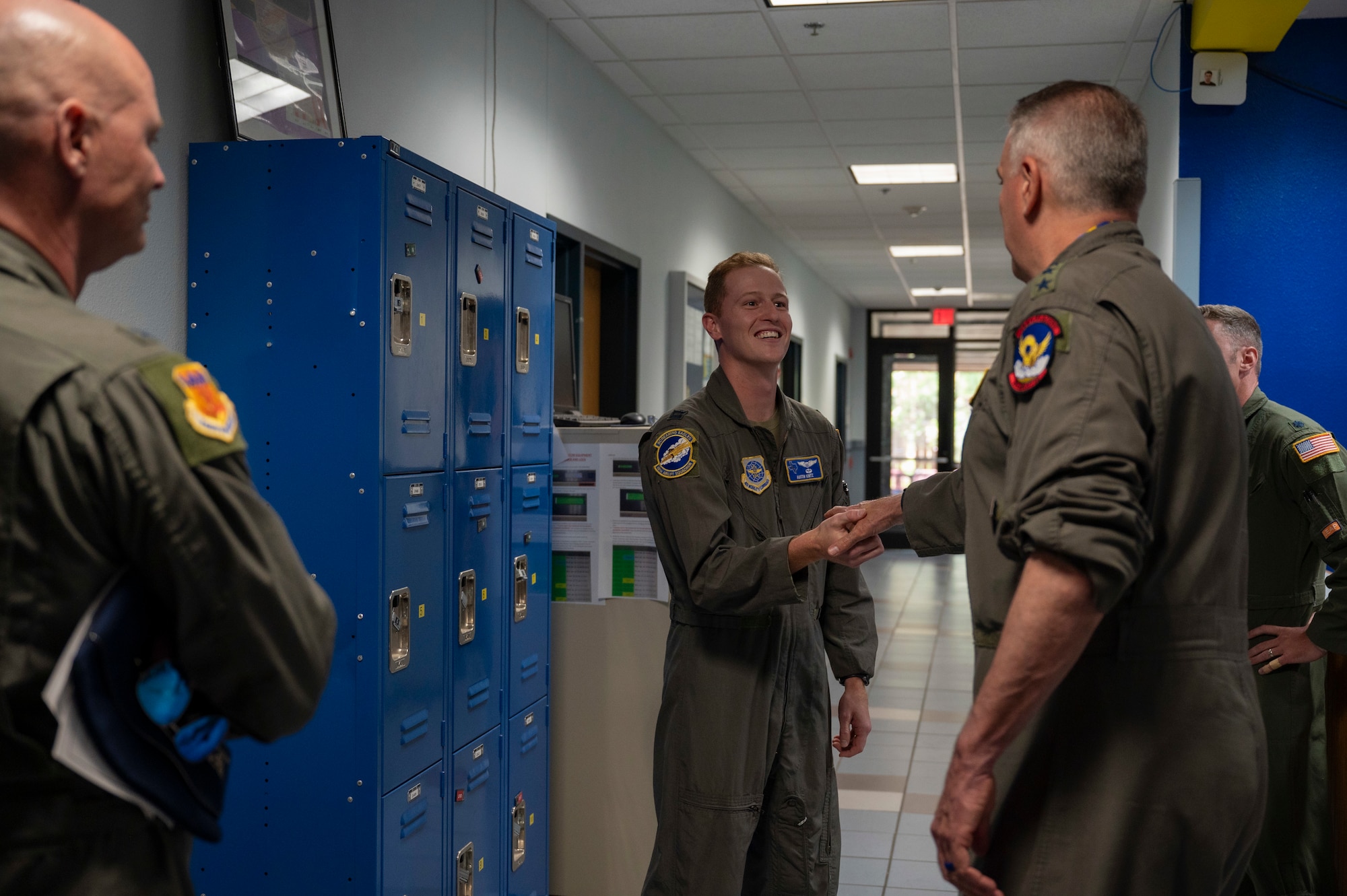 Gen. Mike Minihan, commander of Air Mobility Command, coins Capt. Austin Kintz, 40th Airlift Squadron pilot, at Dyess Air Force Base, Texas, June 13, 2024. Minihan visited the unit and coined numerous star performers, recognizing them for their hard work. (U.S. Air Force photo by Airman 1st Class Emma Anderson)