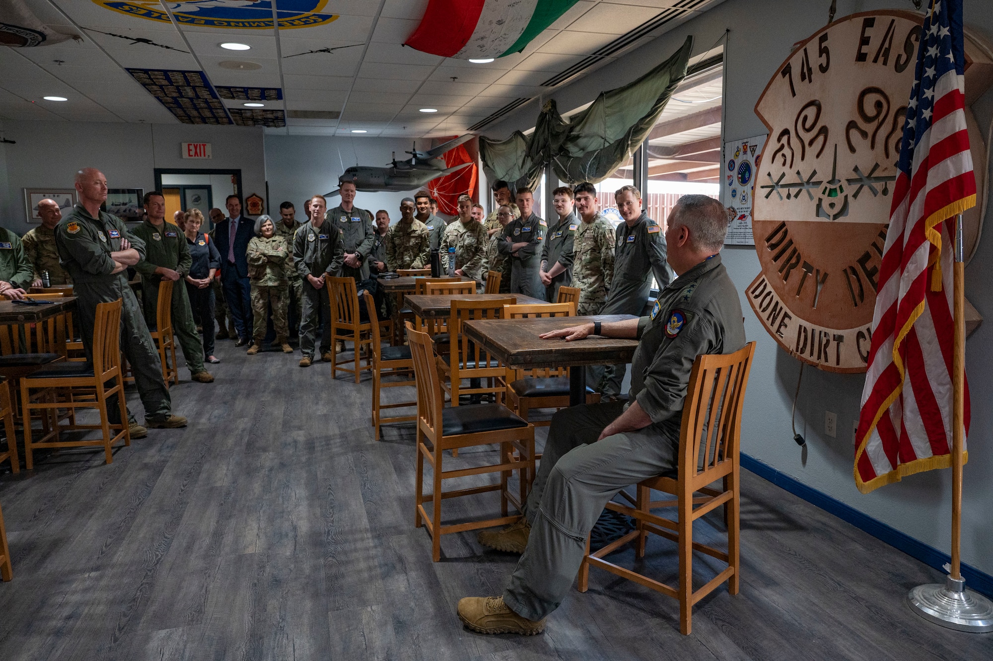 Gen. Mike Minihan, commander of Air Mobility Command, tells stories of his career to Airmen from the 40th Airlift Squadron at Dyess Air Force Base, Texas, June 13, 2024. Minihan served at Dyess as the operations officer and commander of the 40th Airlift Squadron between 2003 and 2006. (U.S. Air Force photo by Airman 1st Class Emma Anderson)