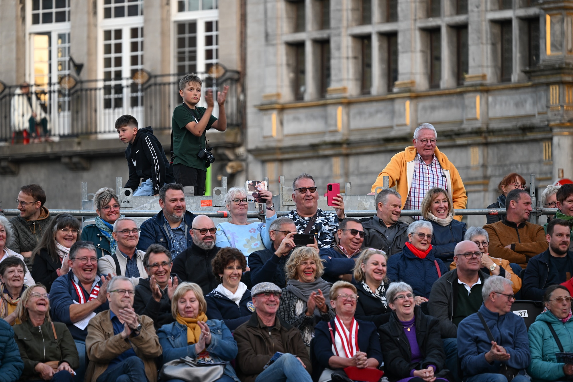The audience at the Belgian Defence International Tattoo 2024 cheers during a performance at the Grand Place at Tournai, Belgium, June 7, 2024.
