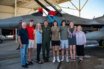 57th Wing commander poses for a group photo with his family