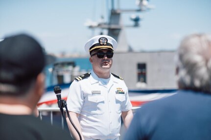 Sailors from Unmanned Surface Vessel Squadron One (USVRON-1) discuss the Medium Displacement Unmanned Surface Vessel (MDUSV) Sea Hunter and the Navy’s advances in unmanned systems with the public during LA Fleet Week, 24 May.