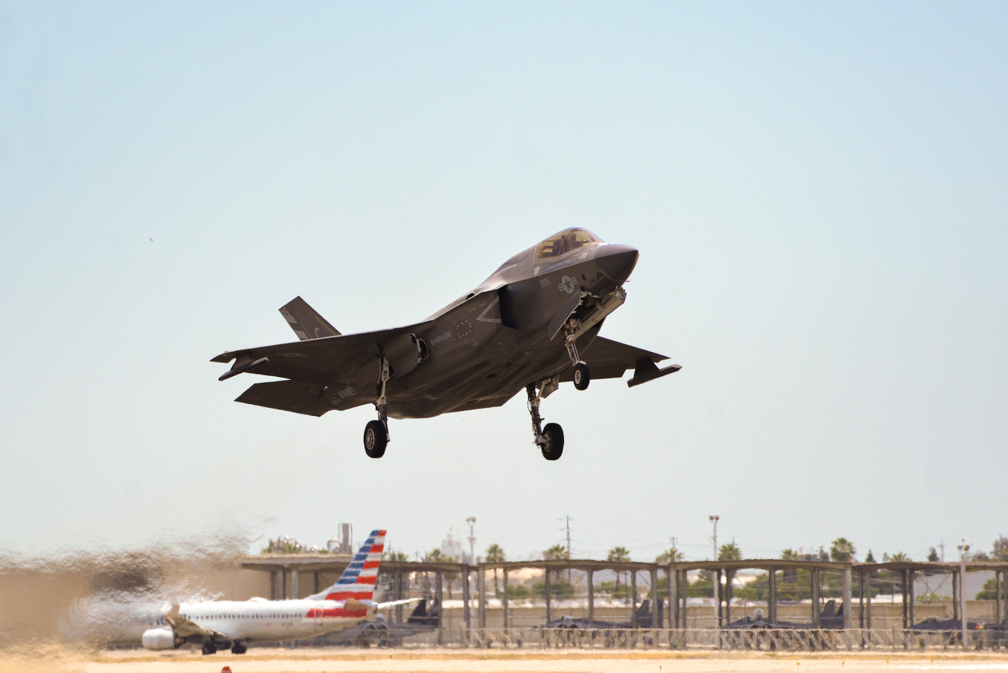 An F-35B Lightning takes off from the Fresno Yosemite International Airport in Fresno, California, June 8, 2024, while F-15C Eagles prepare to taxi from the flightline of the Fresno Air National Guard Base.