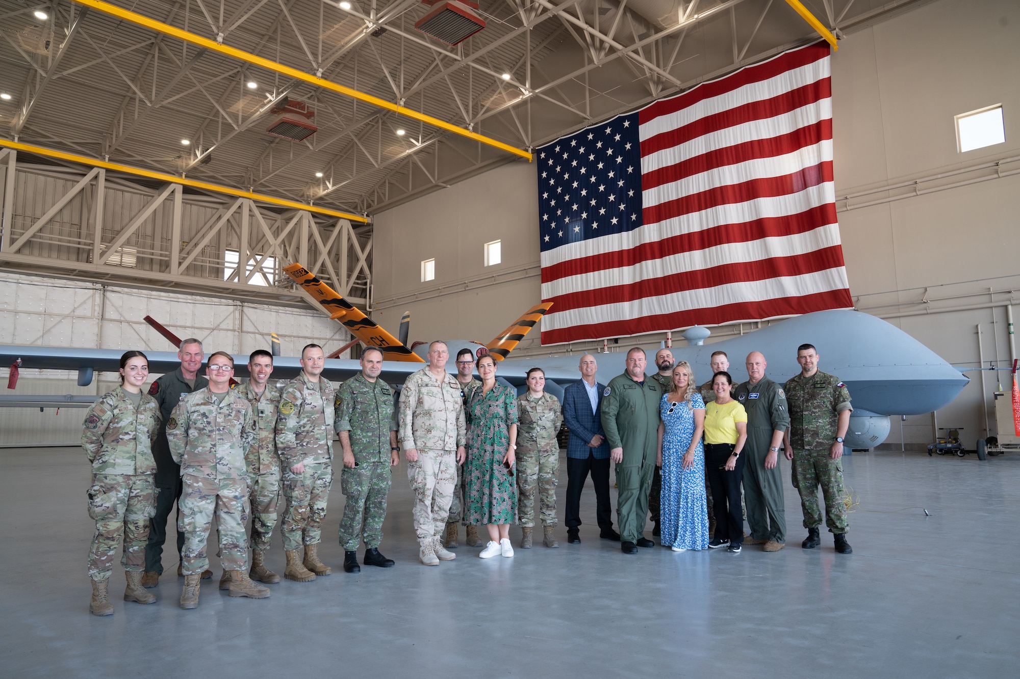 A group of people in military uniforms pose for a photo.