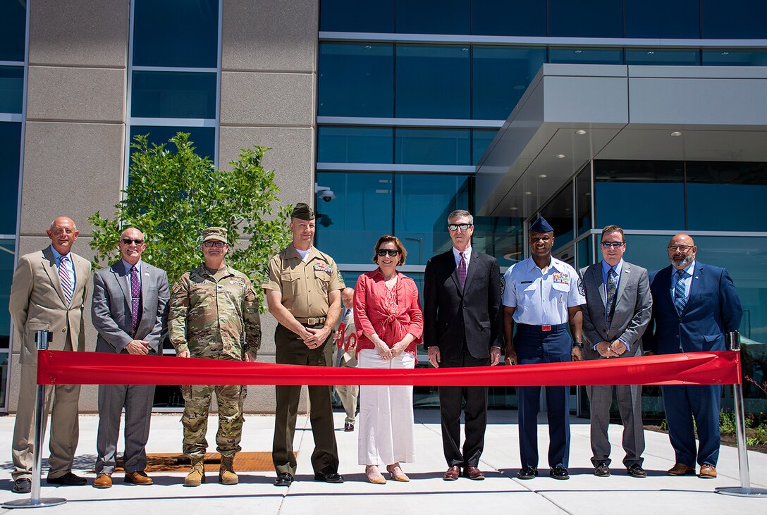 Col. James Handura, third from left, commander, USACE-South Pacific Division, stands with other Defense Threat Reduction Agency and Kirtland Air Force Base officials including DTRA Director Rebecca Hersman, center, before Hersman cut the ribbon, officially opening the new building on Kirtland Air Force Base, June 12, 2024.