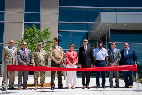 Col. James Handura, third from left, commander, USACE-South Pacific Division, stands with other Defense Threat Reduction Agency and Kirtland Air Force Base officials including DTRA Director Rebecca Hersman, center, before Hersman cut the ribbon, officially opening the new building on Kirtland Air Force Base, June 12, 2024.