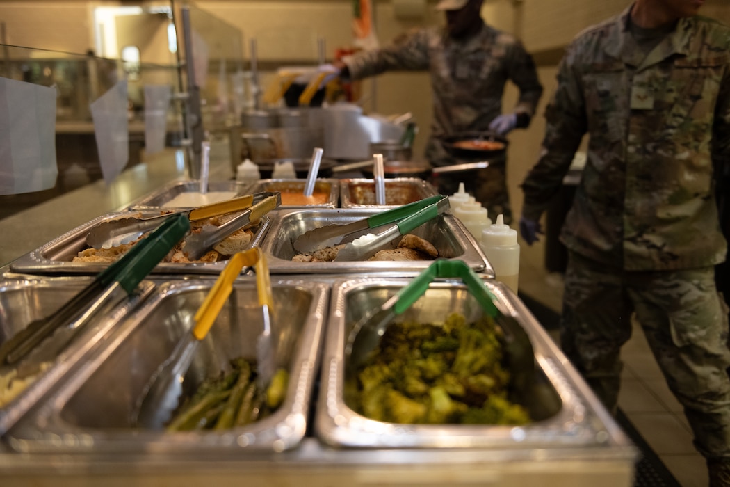 Airmen prepare food
