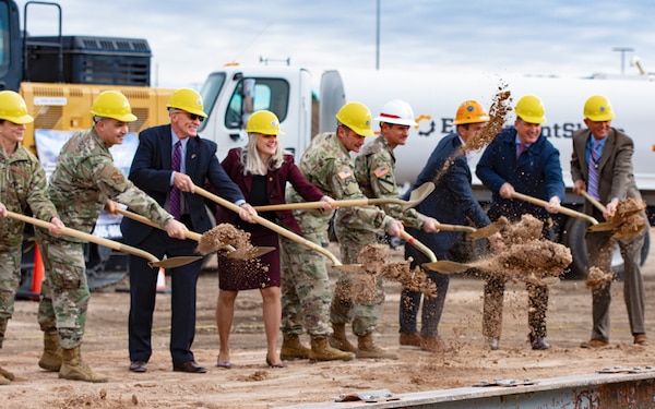 Albuquerque District commander Lt. Col. Pat Stevens (4th from right in white hat), joins the Defense Threat Reduction Agency's Director of Acquisition, Finance, and Logistics, Lisa Swan, and other dignitaries in the ceremonial earth turning to mark the beginning of construction on a much-needed DTRA administrative building, Dec. 9, 2021, at Kirtland Air Force Base, N.M.