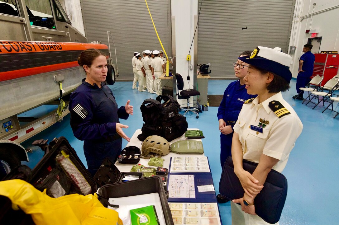 Lt. Titus from Maritime Safety and Security Team Honolulu discusses law enforcement at U.S. Coast Guard Forces Micronesia Sector Guam for over 40 cadets from the Japanese Coast Guard training ship Kojima during their visit to Guam on June 12, 2024. The event marked a significant moment of international cooperation and camaraderie between the two maritime services. (U.S. Coast Guard photo by Josiah Moss)