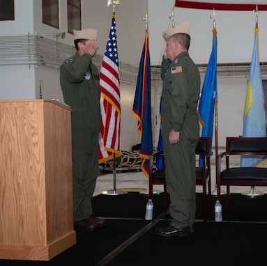 Adm. Samuel J. Paparo, commander, U.S. Indo-Pacific Command, and Rear Adm. Gregory C. Huffman exchange salutes during the Joint Task Force – Micronesia assumption of command ceremony on Andersen Air Force Base, June 14, 2024.