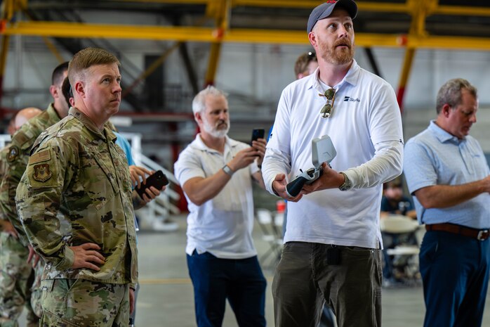 Airman talks to civilian.