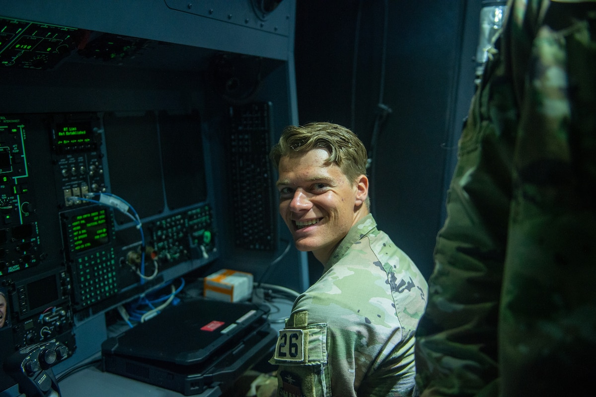 U.S. Air Force Cadet 2nd Class Jared Switzer, U.S. Air Force Academy Cadet, Squad 31, poses for a photo in an HC-130J Combat King II flight simulator at Moody Air Force Base, Georgia, June 6, 2024. USAFA cadets came to Moody AFB for Operation Air Force, a required summer program that gives cadets the opportunity to see an operational Air Force base. (U.S. Air Force photo by Airman 1st Class Iain Stanley)