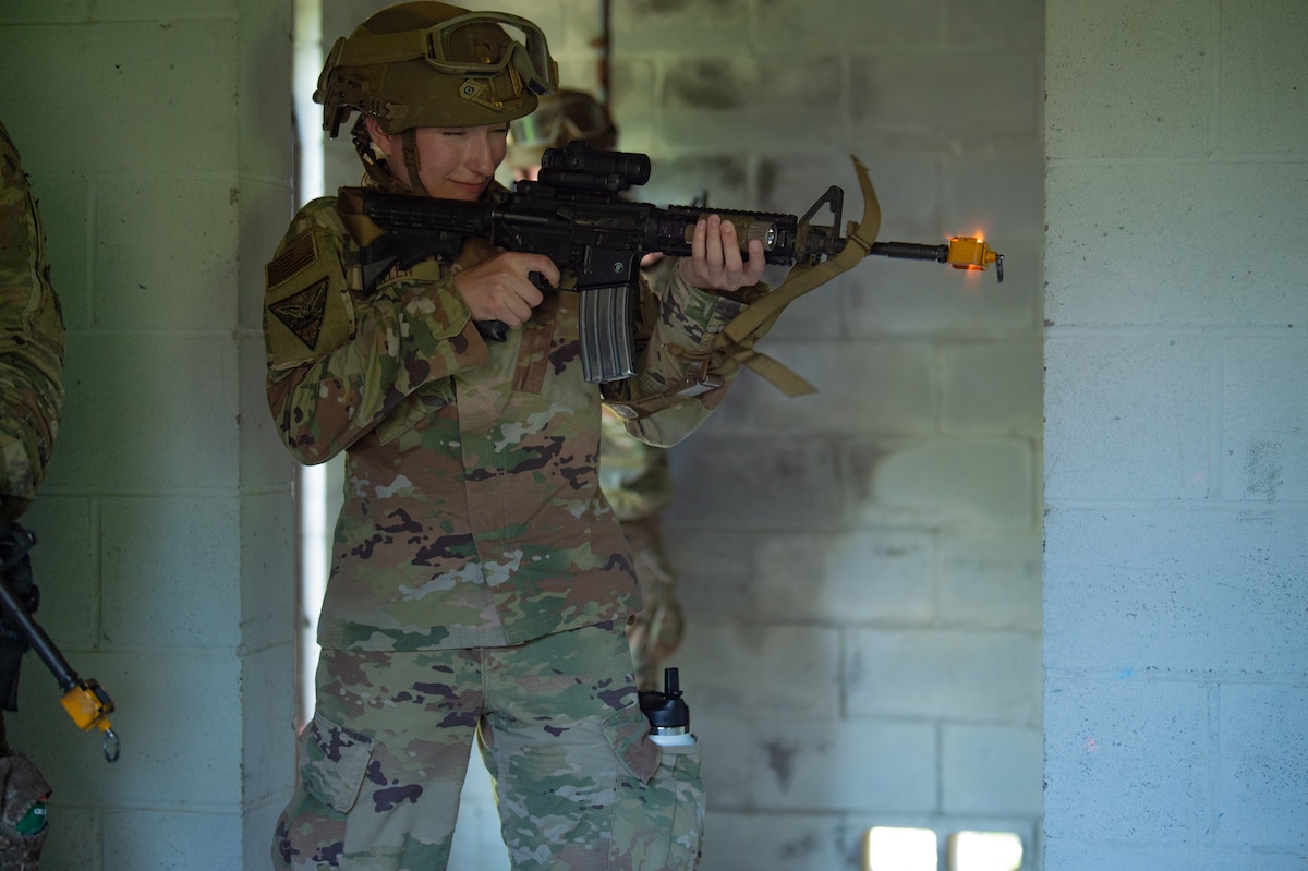 U.S. Air Force Cadet 2nd Class Mary Allen, U.S. Air Force Academy cadet, Squad 24, fires practice rounds from an M4A1 at Moody Air Force Base, Georgia, June 7, 2024. The 820th Base Defense Group taught the cadets how to properly clear a room of any combatants using practice rounds. (U.S. Air Force photo by Airman 1st Class Iain Stanley)
