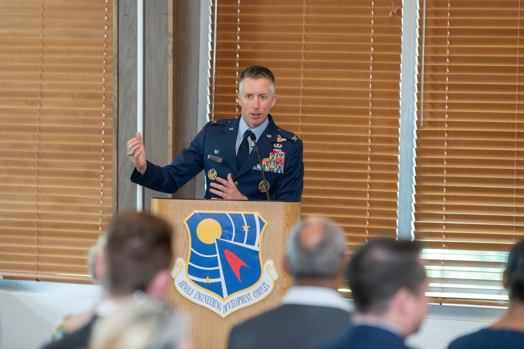Col. Grant Mizell addresses those in attendance to see him become the 33rd commander of Arnold Engineering Development Complex during a Change of Command ceremony June 13, 2024, at the Arnold Lakeside Complex on Arnold Air Force Base, Tenn., headquarters of AEDC. (U.S. Air Force photo by Keith Thornburgh)