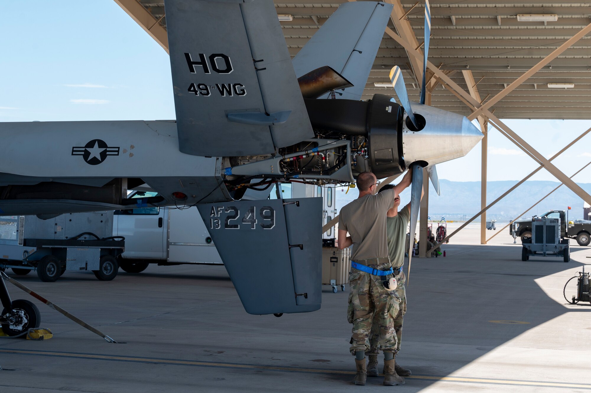 Airmen from the 49th Aircraft Maintenance Squadron perform maintenance on an MQ-9 Reaper at Holloman Air Force Base, New Mexico, June 11, 2024