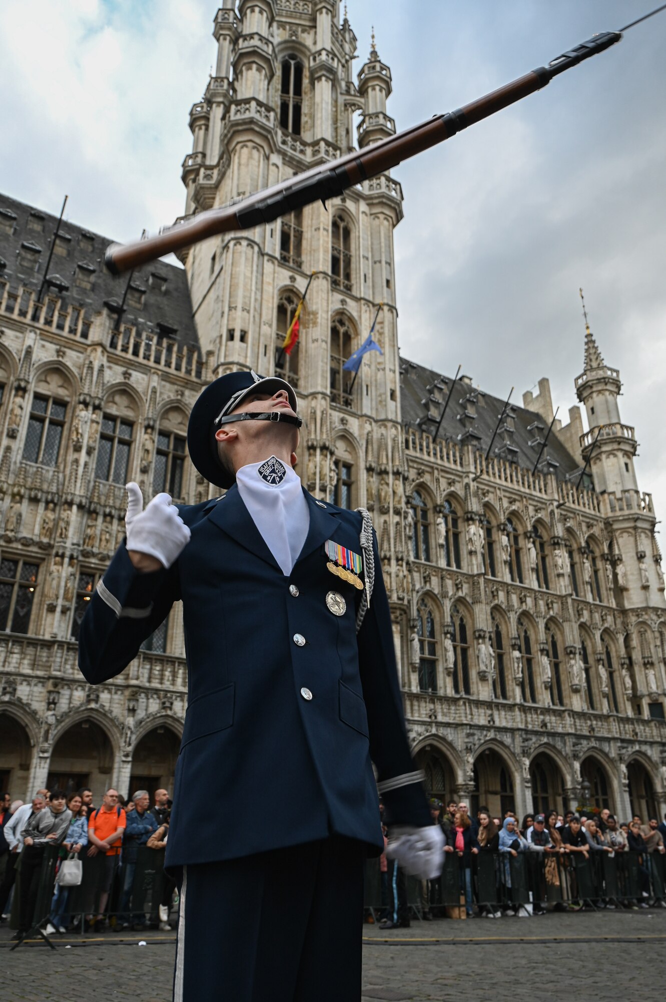 U.S. Air Force Senior Airman Michael C. Hester, Air Force Honor Guard ceremonial guardsman, performs a rifle toss during a meet-and-greet at the Belgian Defence International Tattoo 2024 in Brussels, Belgium, June 8, 2024.