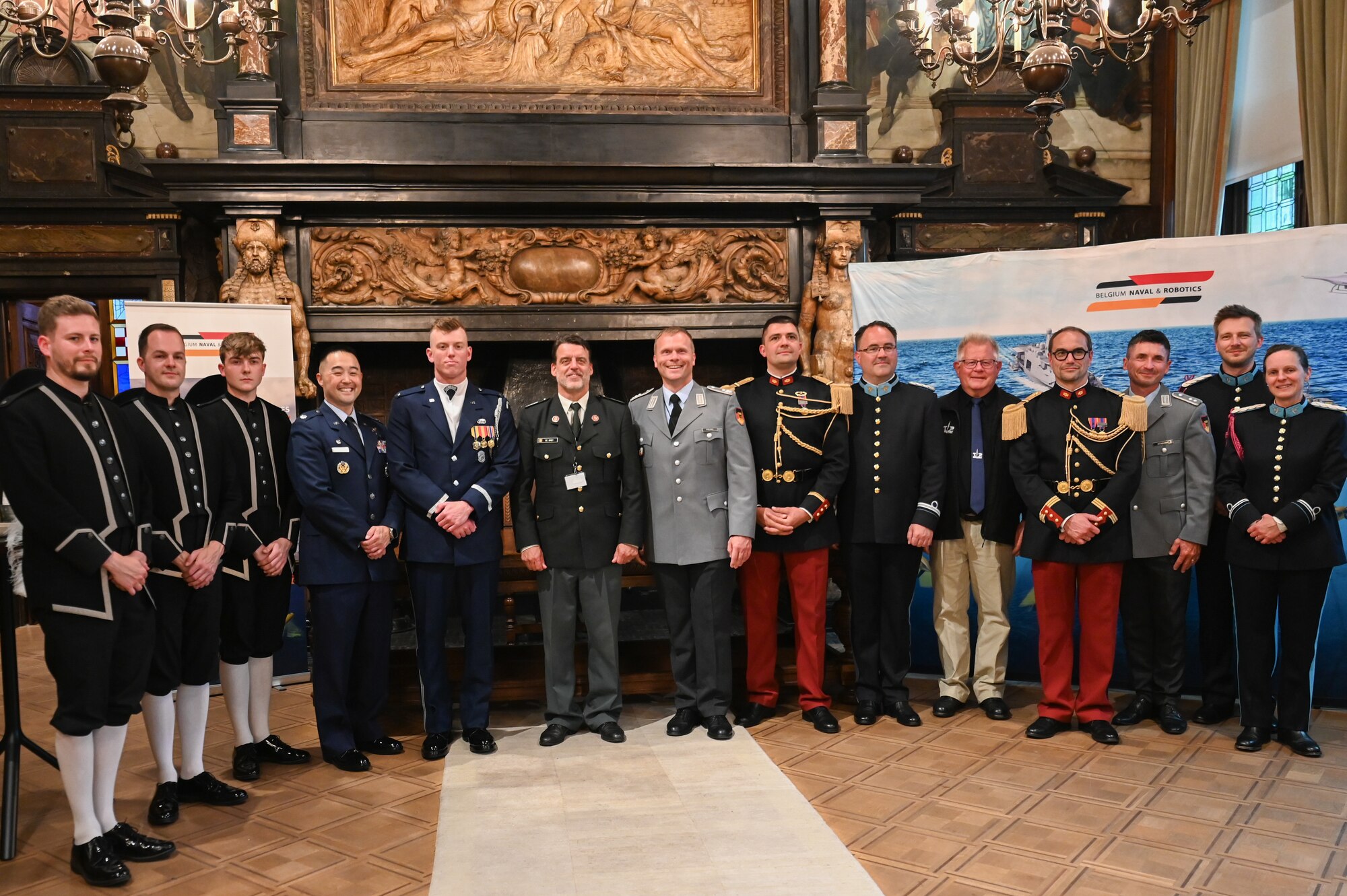 Leaders from military performance teams representing the United States, Switzerland, Belgium, France, Germany and the Netherlands pose for a group photo at the Belgian Defence International Tattoo 2024 in Antwerpen, Belgium, June 6, 2024.