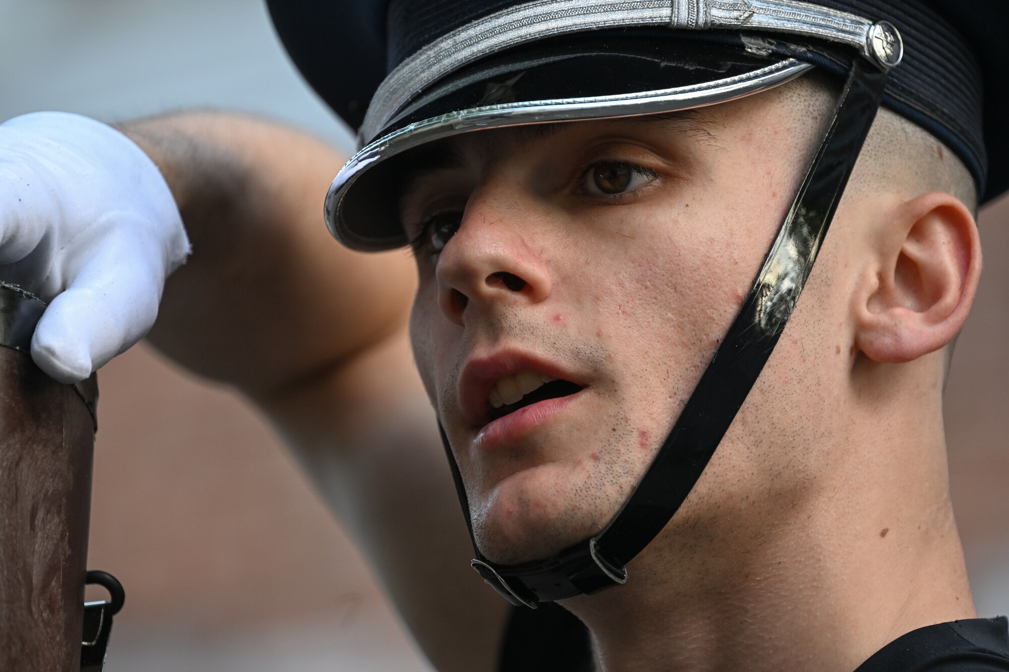 U.S. Air Force Senior Airman Michael C. Hester, Air Force Honor Guard ceremonial guardsman, practices the flat order drill movement before going on stage at the Belgian Defence International Tattoo 2024 in Leuven, Belgium, June 4, 2024.