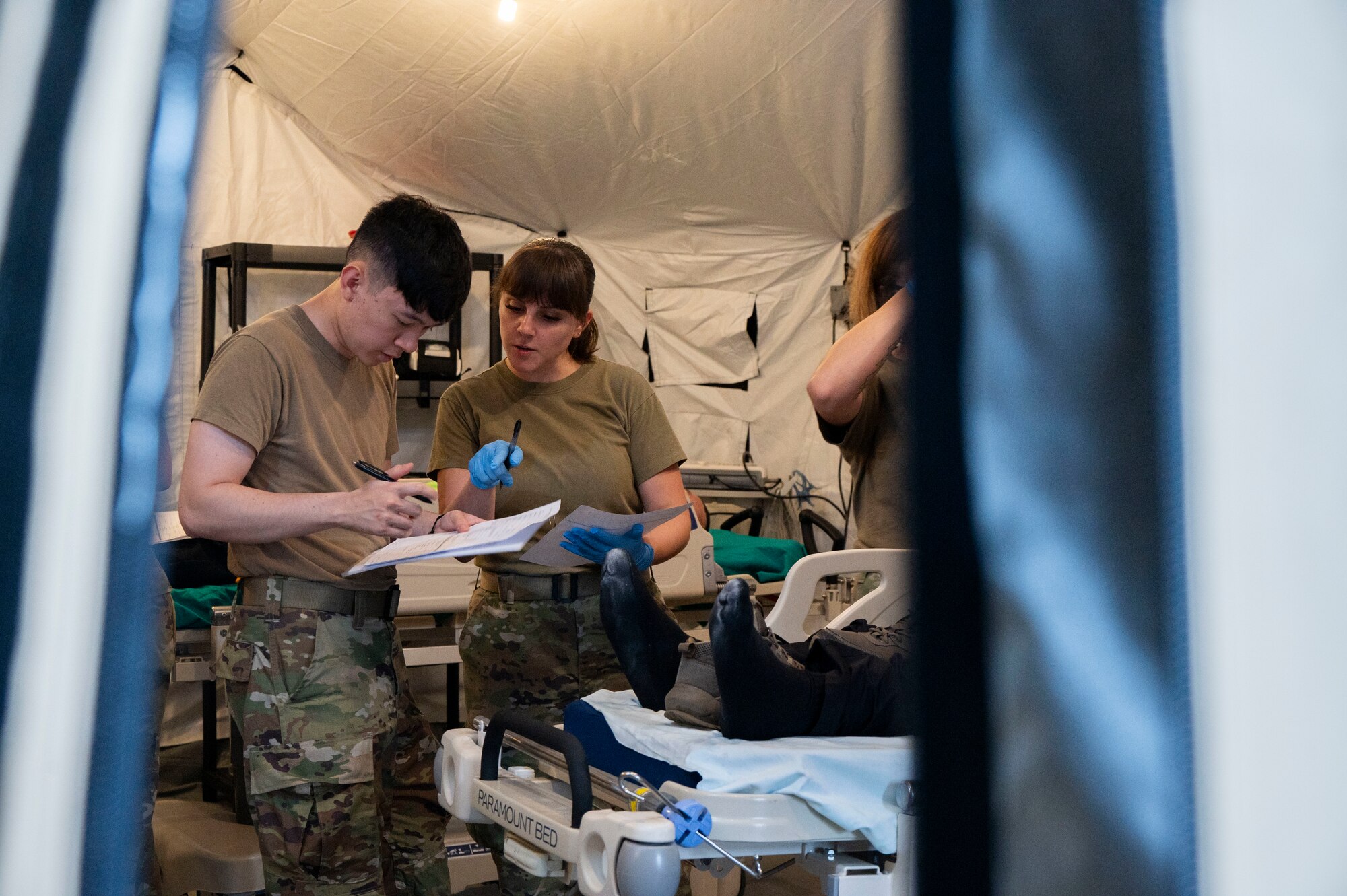 A photo of two people looking over documents.