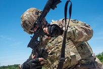 Army Sgt. Margarita Ferreira from the 405th Army Field Support Brigade assembles an M4 carbine rifle during the U.S. Army Sustainment Command Best Warrior Competition at the Marseilles Training Center, Illinois. The maintenance noncommissioned officer at the brigade headquarters represented the 405th AFSB well at the ASC competition. (photo by Hayley Smith, U.S. Army Sustainment Command Public Affairs)